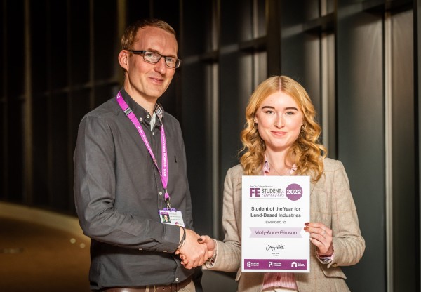 Molly-Anne Gimson receiving her Further Education award certificate from Chris Sturdy, Head of Animal and Equine, Easton College (Pic - David Kirkham)