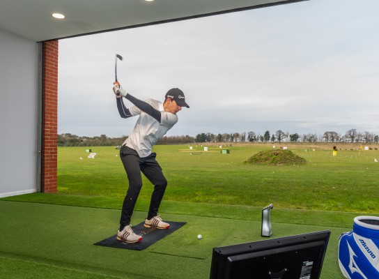 Sport student practicing golf swing