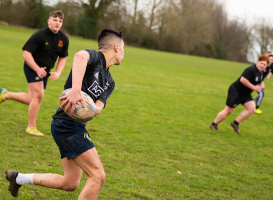 Sport students playing rugby
