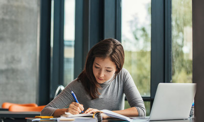 University student studying at desk